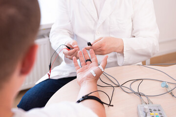 Patient nerves testing using electromyography at medical center