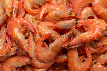 Shrimps background texture. A lot of shrimps. Cooked shrimps.