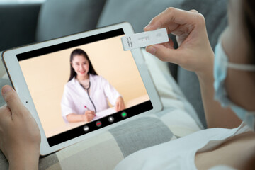 Woman consulting with doctor about COVID-19 testing.