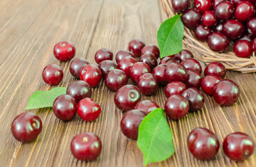 Sweet juicy cherries on a wooden table