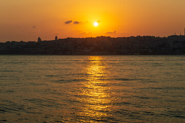 Fiery Sunset sky over sea in the evening with orange sunlight(Istanbul)