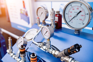 Monometers of different sizes on a light background
