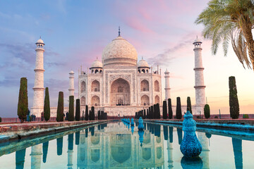 Gorgeous Taj Mahal behind the palm tree, symbol of India, Agra, Uttar Pradesh