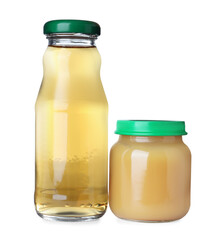 Baby food in jar near bottle of juice on white background