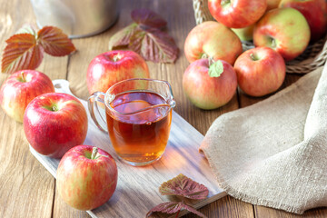 Fresh fruit apple juice vinegar homemade cider in a glass jug
