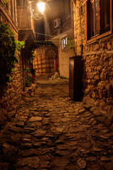 Fototapeta premium Narrow street of old town of Nessebar in Bulgaria at night