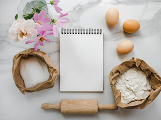 Cooking homemade bakery products. Close-up, view from above, wooden board. White, isolated background. Delicious and healthy food concept