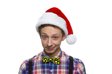 Portrait of teenage boy with christmas santa's hat.