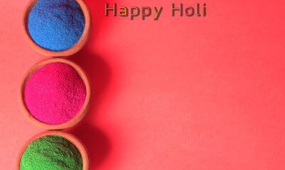 Diwali Festival showing Colourful rangoli in bowls,clay lamp or diya on background