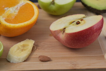Naklejka na ściany i meble Bueterful fruit in different shapes. Apples, lime, orange banana, avocado