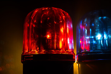 Police car blue and red round vintage siren in dark. Rotating retro style police siren in dark.