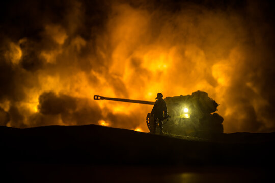 War Concept. Military silhouettes fighting scene on war fog sky background, World War Soldiers Silhouette Below Cloudy Skyline At night. Battle in ruined city.