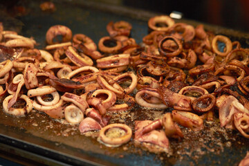 Fried squid in a cast iron pan