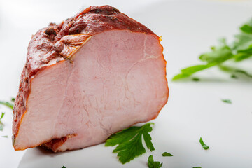 Piece of smoked pork ham with herbs