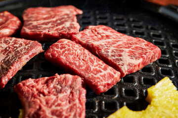 raw meat on grill