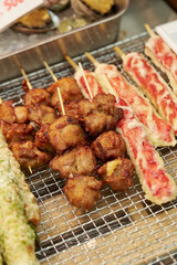 Chicken and tempura displayed in a traditional market