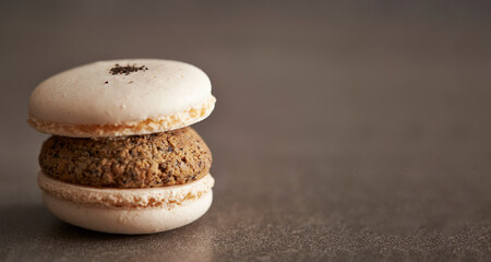 Peanut cream macaron on gray background