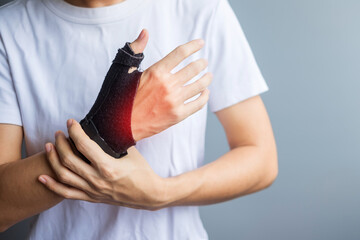 woman holding her wrist pain because using smartphone or computer long time. De Quervain's tenosynovitis, Intersection Symptom, Carpal Tunnel Syndrome or Office syndrome concept - obrazy, fototapety, plakaty