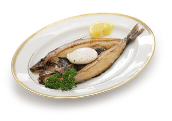 kippers and poached egg, traditional British breakfast dish