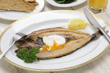 kippers and poached egg, traditional British breakfast dish