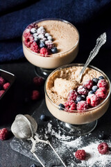 Ryazhenka mousse in glass bowls decorated with fresh berries