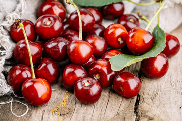 Ripe red cherries on a wooden table