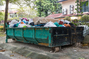 Rubbish dumspter or roro bin with load of waste from construction debris
