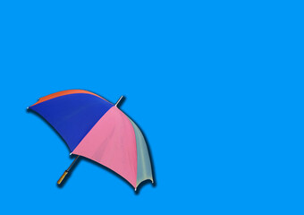 Closeup, Single rainbow umbrella isolated on white background for stock photo or design, invesment, business, summer concept
