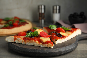 Slices of delicious pita pizza on wooden table