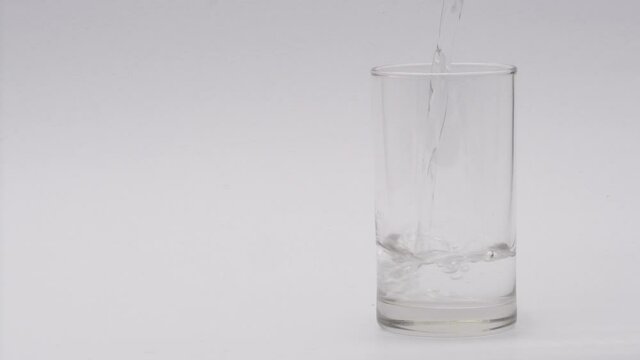 Pour fresh clean water into a glass filled with ice.
