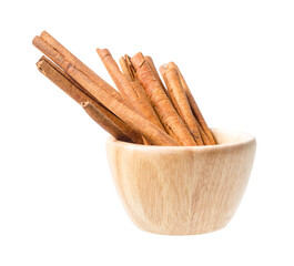 Cinnamon sticks in wooden bowl isolated on white background.