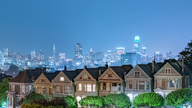 San Francisco Painted Ladies and Downtown Skyline Tilt Down Night Time Lapse California USA