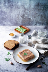 Meat aspic in a plate with mustard