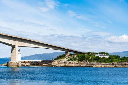 The Scottish Skye Road Bridge as it connects to the small island Eilean Ban in Loch Alsh, Scotland, UK.  Also shown is the Kyleakin Lighthouse