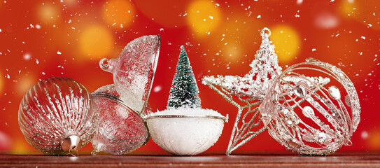 vintage glass baubles star and small Christmas tree in snow red background. Merry Christmas and Happy New Year seasons greetings card. Crystal and golden elegant retro style decoration wide banner