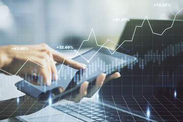 Abstract creative financial graph with finger clicks on a digital tablet on background, forex and investment concept. Multiexposure