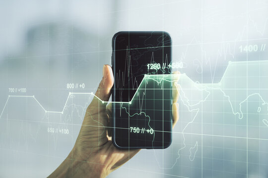 Multi exposure of abstract statistics data hologram interface and hand with cellphone on background, computing and analytics concept