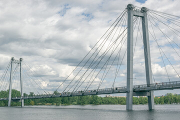 Fototapeta premium Cable-stayed bridge against the backdrop of beautiful clouds