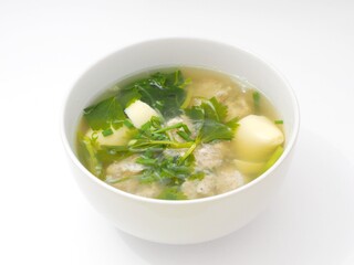 Picture of the soup with pork  tofu and coriander