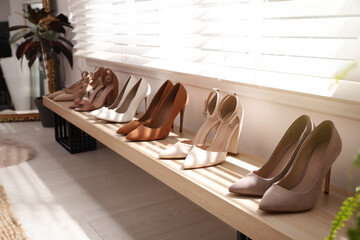 Fototapeta na wymiar Collection of beautiful shoes in dressing room
