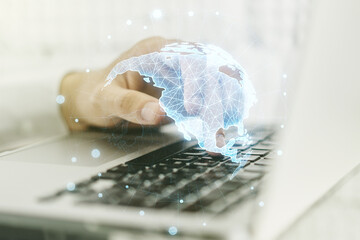Digital America map and hands typing on laptop on background, international trading concept. Multiexposure