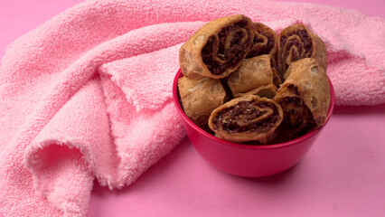 Indian traditional Snacks Bhakarvadi or Bakarvadi. Diwali snacks Bhakarwadi, selective focus.