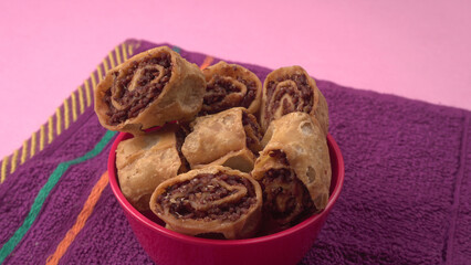 Indian traditional Snacks Bhakarvadi or Bakarvadi. Diwali snacks Bhakarwadi, selective focus.