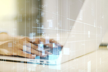 Fototapeta premium Multi exposure of stats data illustration with hands typing on computer keyboard on background, computing and analytics concept