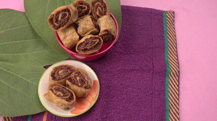 Indian traditional Snacks Bhakarvadi or Bakarvadi. Diwali snacks Bhakarwadi, selective focus.