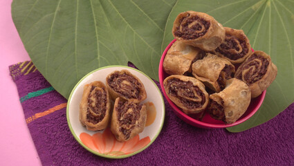 Indian traditional Snacks Bhakarvadi or Bakarvadi. Diwali snacks Bhakarwadi, selective focus.