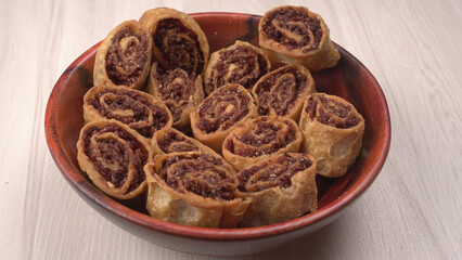 Indian traditional Snacks Bhakarvadi or Bakarvadi. Diwali snacks Bhakarwadi, selective focus.