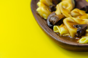 Fresh egg pasta with ricotta cheese and porcini mushrooms paste filling, delicious tortelloni