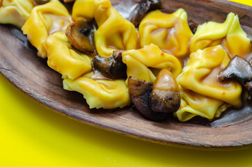 Fresh egg pasta with ricotta cheese and porcini mushrooms paste filling, delicious tortelloni