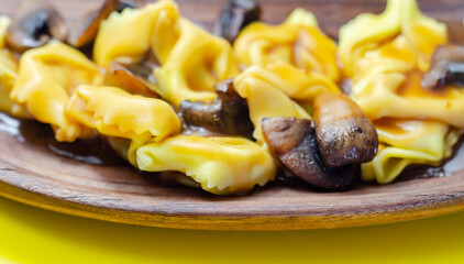 Fresh egg pasta with ricotta cheese and porcini mushrooms paste filling, delicious tortelloni